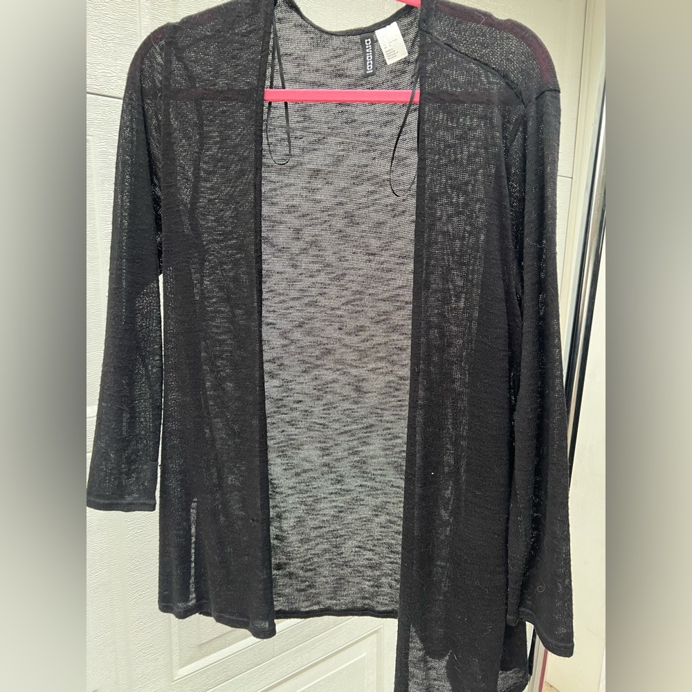 Woman’s black cardigan